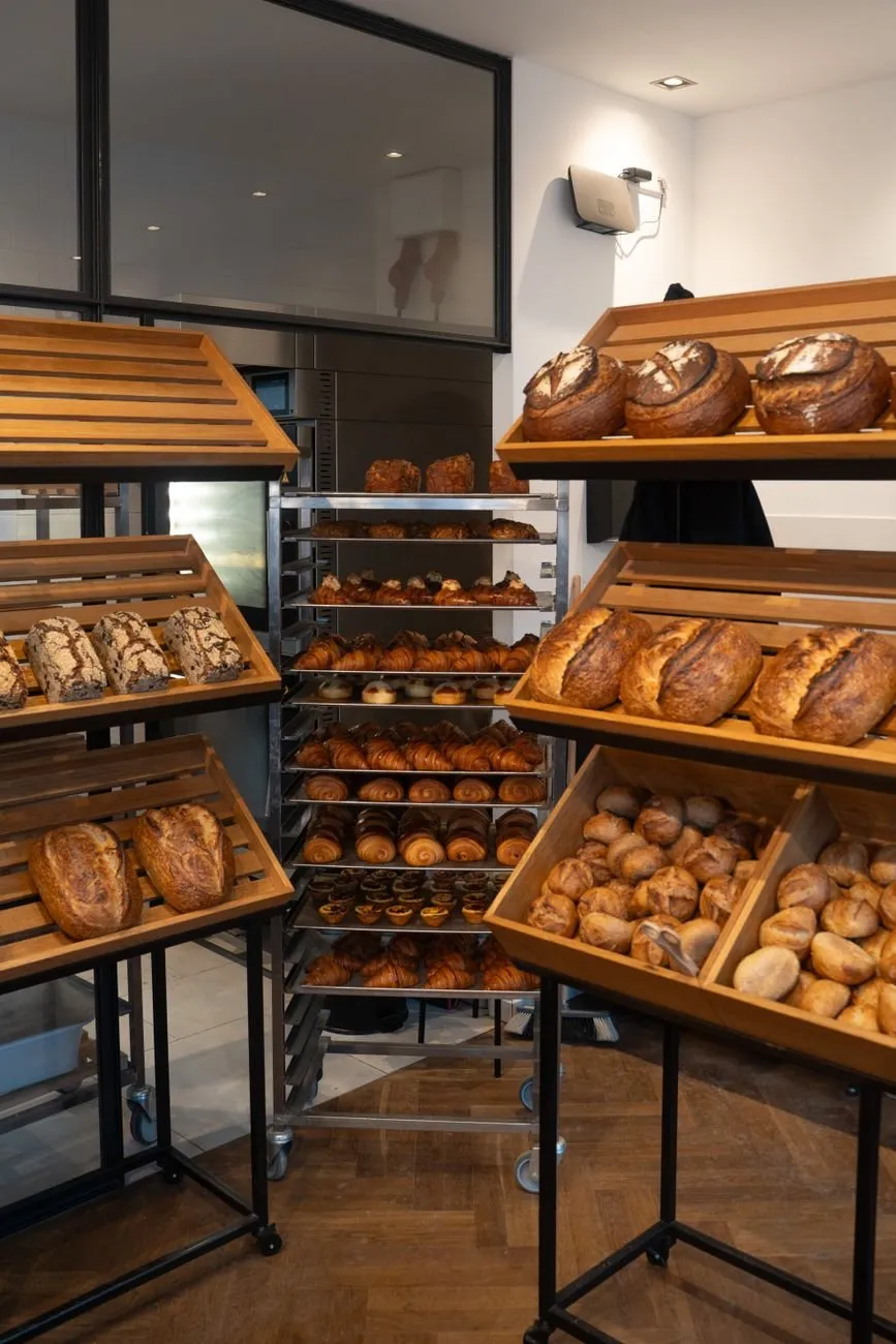 Bakery racks and wooden display crates full of loaves ready for the morning delivery